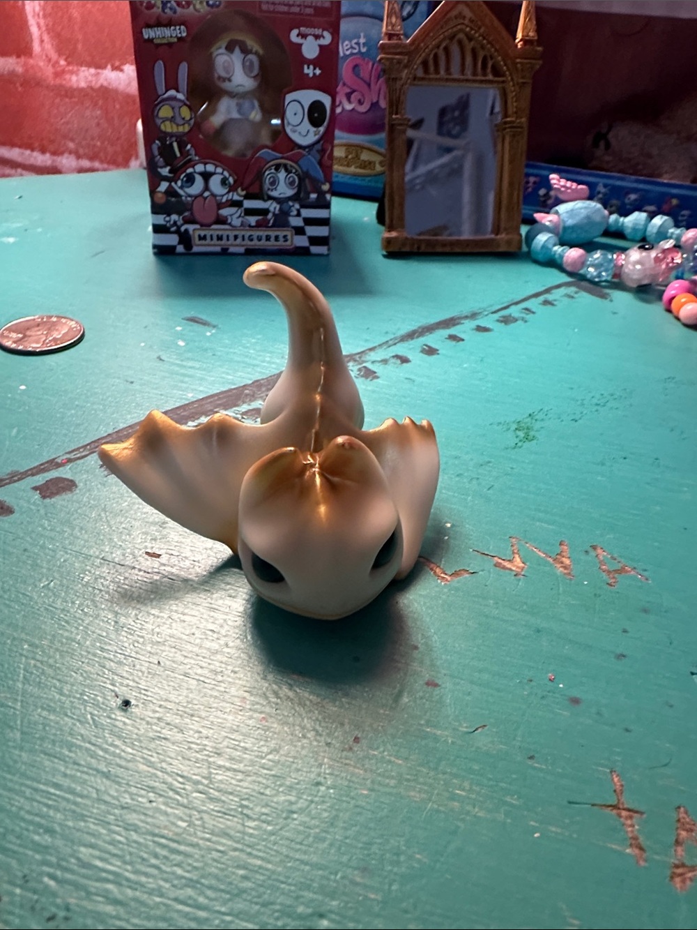 Small, cute, white and gold dragon figure